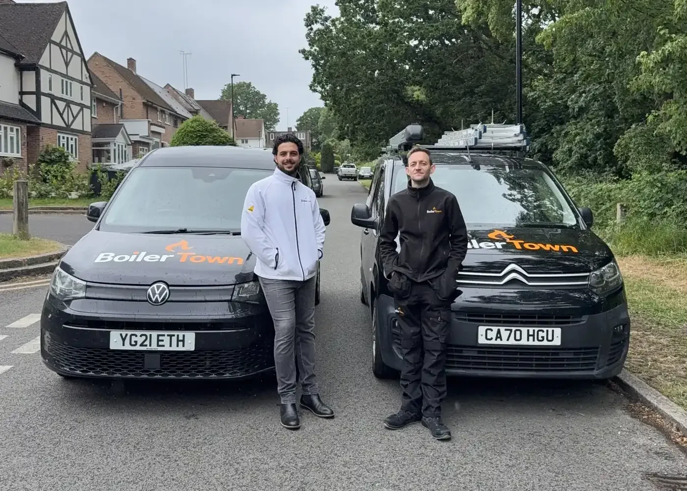 The Boiler Town team with two of their vans